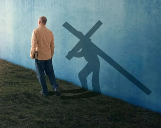 A man walking with his shadow carrying the cross.  Digitally mastered photo by Kevin Carden,  2014   ©Kevin Carden / GoodSalt