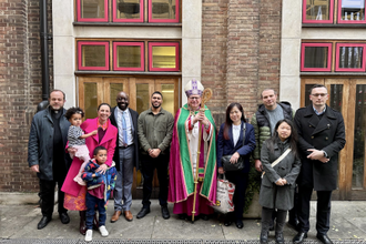 Archbishop John  with some of the fledgling Catholics and their sponsors. Image: rcaos.org.uk