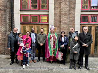 Archbishop John  with some of the fledgling Catholics and their sponsors. Image: rcaos.org.uk