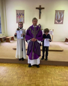 Maja and Antoni, receiving their prizes today, with Canon Rob Esdaile, Parish Priest of St Dunstan's, Woking and St Hugh of Lincoln, Knaphill, Surrey.