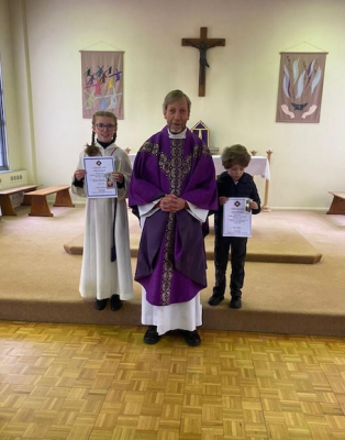 Maja and Antoni, receiving their prizes today, with Canon Rob Esdaile, Parish Priest of St Dunstan's, Woking and St Hugh of Lincoln, Knaphill, Surrey.