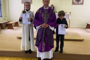 Maja and Antoni, receiving their prizes today, with Canon Rob Esdaile, Parish Priest of St Dunstan's, Woking and St Hugh of Lincoln, Knaphill, Surrey.