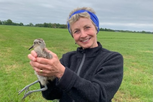 Mary Colwell with Curlew chick