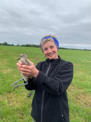 Mary Colwell with Curlew chick