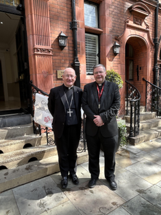 Archbishop Richard Moth with Fr Dominic Robinson outside the centre