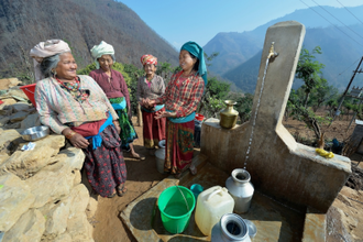Women gather at community water tap, provided by Dan Church Aid, part of the ACT Alliance, in Salang village, Nepal, devastated by the 2015 earthquake. Photo: Paul Jeffrey/Life on Earth