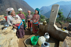 Women gather at community water tap, provided by Dan Church Aid, part of the ACT Alliance, in Salang village, Nepal, devastated by the 2015 earthquake. Photo: Paul Jeffrey/Life on Earth