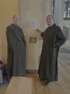 Abbot Dominic Taylor and Safeguarding lead, Fr Timothy Gorham with the plaque.