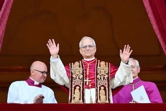 Pope Leo appears on the balcony of St Peter's