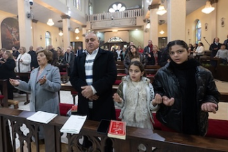 Prayers at Christ the Redeemer church in Taybeh