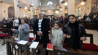 Prayers at Christ the Redeemer church in Taybeh