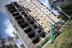 Residential buildings in Irpin, Kyiv region, attacked by Russia, Aug 2022. Photo: Ivars Kupcis/WCC