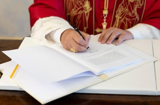 Pope Leo XIV signs 'Magnifica humanitas' at the Vatican, May 15, 2026. Image Vatican Media