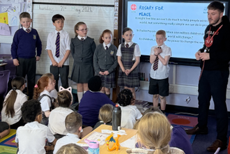 Children praying the rosary at St Aidan's Primary School, Wishaw, Scotland