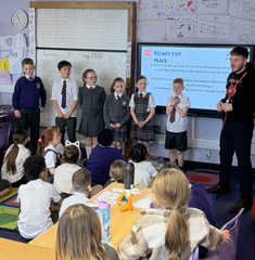 Children praying the rosary at St Aidan's Primary School, Wishaw, Scotland
