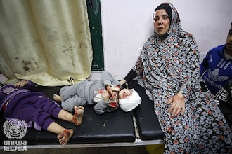 Mother and child injured in Israeli attack await treatment at Al-Aqsa Hospital. Image UNRWA