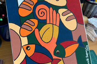 Artist Harold Segura, a WV Regional Director of Faith & Development, provided this picture showing open hands holding loaves & fish - not hoarding, not scarcity, but gift & possibility