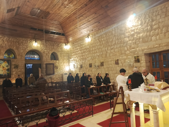 Fr Youssef Semaan during Mass in Kfour, which has seen the Christian community plummet © ACN