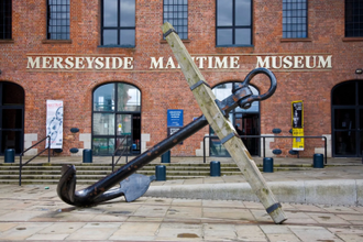 The HMS Conway Anchor, outside the Merseyside Maritime Museum, Albert Docks, Liverpool, Merseyside, Cast iron and wood © Alamy