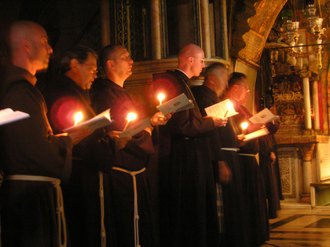 Catholic friars during procession in Holy Sepulchre, Jerusalem, 2006 by Abraham Sobkowski OFM