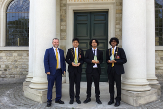 Headteacher Chris McCormack with award winners: Abdul Majid, Reuben, and Luginton