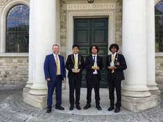 Headteacher Chris McCormack with award winners: Abdul Majid, Reuben, and Luginton