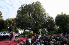 Andrea Bocelli and children's choir sing at the prayer gathering at Borgo Laudato si'