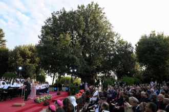Andrea Bocelli and children's choir sing at the prayer gathering at Borgo Laudato si'