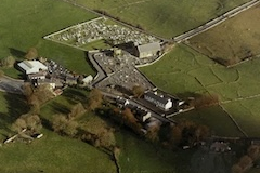 Mayo Abbey ruin with new church