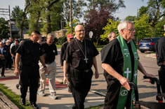 Archbishop Edward Weisenburger of Detroit, centre, walks with priests and lay Catholics from Most Holy Trinity Church to the city's ICE office on July 14, 2025, carrying a letter demanding humane enforcement. Staff refused to accept it at the door.