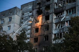 Firefighters at block of flats hit by Russian drone recently. . Image: Vatican Media