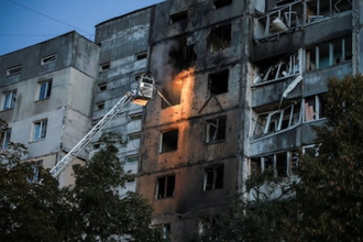 Firefighters at block of flats hit by Russian drone recently. . Image: Vatican Media