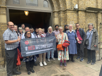 Joanna Bogle with pilgrims outside Church of the Most Precious Blood, Southwark (© ACN)