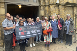 Joanna Bogle with pilgrims outside Church of the Most Precious Blood, Southwark (© ACN)