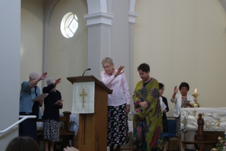 Sister Andrea Nenzel, CSJP, Congregation Leader leads blessing of Liz Dodd, CSJP
