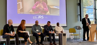 Dr Ryall addresses conference
