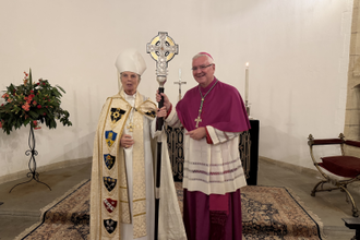 Archbishop Cherry Vann with Archbishop Mark O'Toole and the Coronation Cross