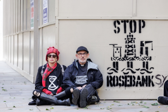 Sue Hampton and Rev James Grote with their 'Banksy' message - image Crispin Hughes
