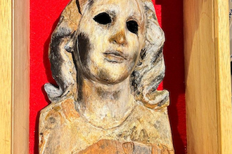 'Atomic Bomb Mary', the only surviving part of a wooden statue found in Nagasaki Urakami Cathedral