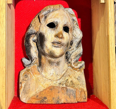 'Atomic Bomb Mary', the only surviving part of a wooden statue found in Nagasaki Urakami Cathedral
